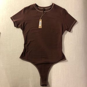 Brand new SKIMS cotton tshirt bodysuit size small in color chocolate